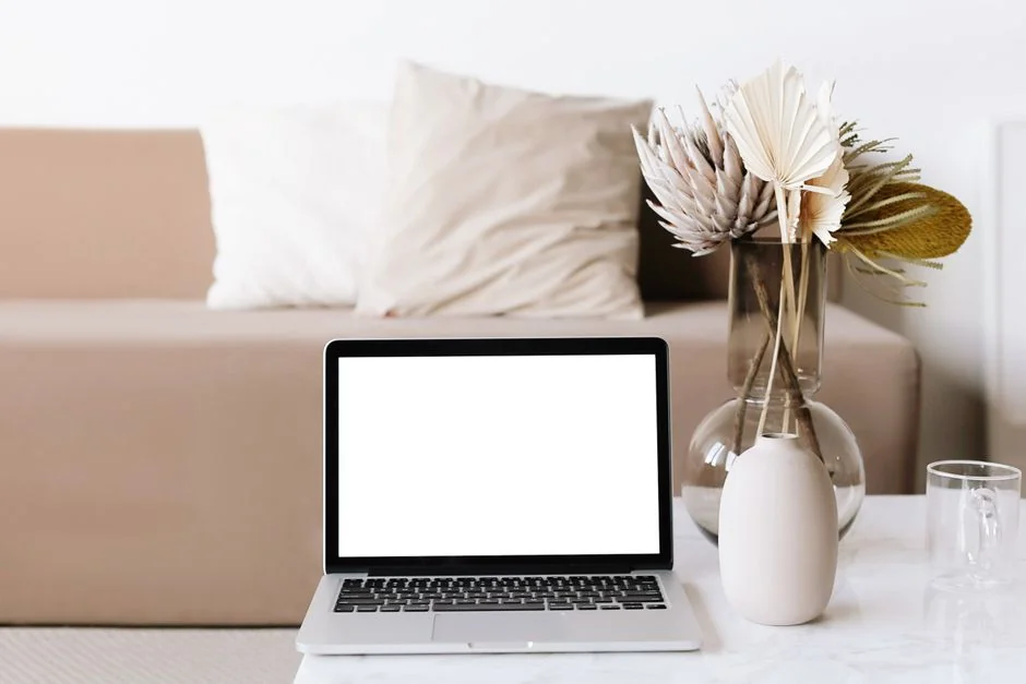 A contemporary workspace showcasing a laptop, tablet, and smartphones, ideal for tech and freelance use.